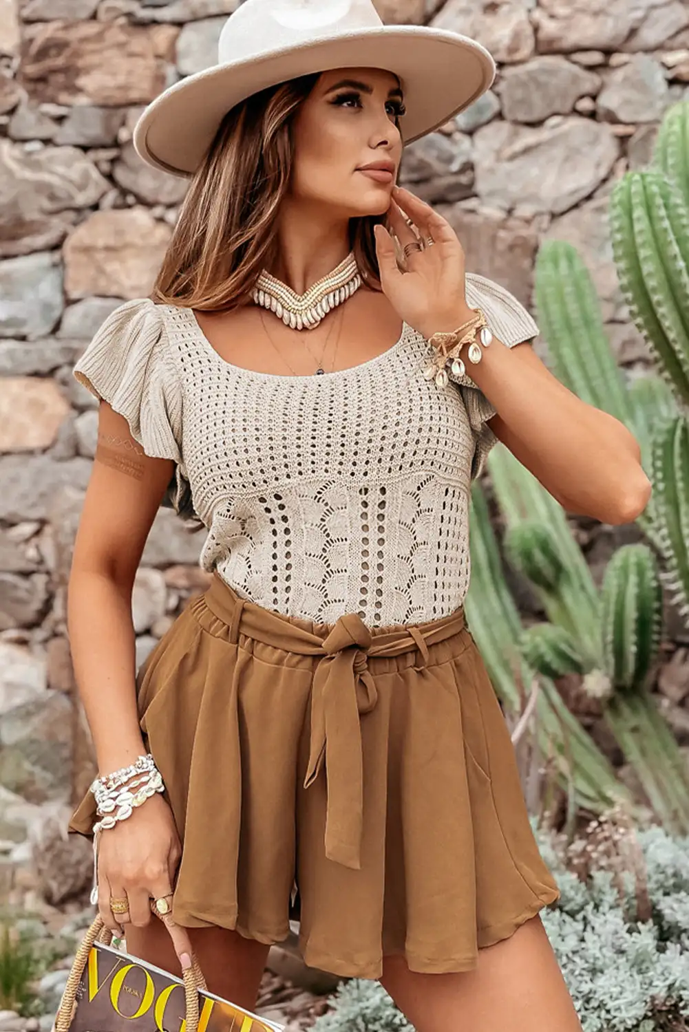 Another angle of the beige flutter-sleeve knit sweater
