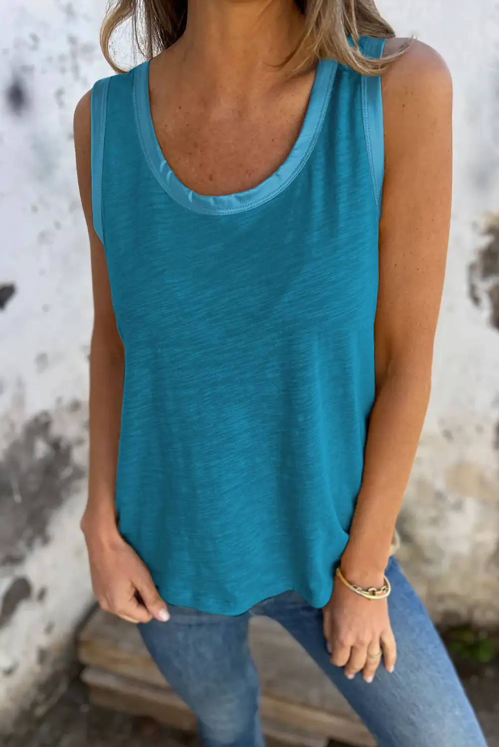 Side view of the scoop-neck tank in daylight